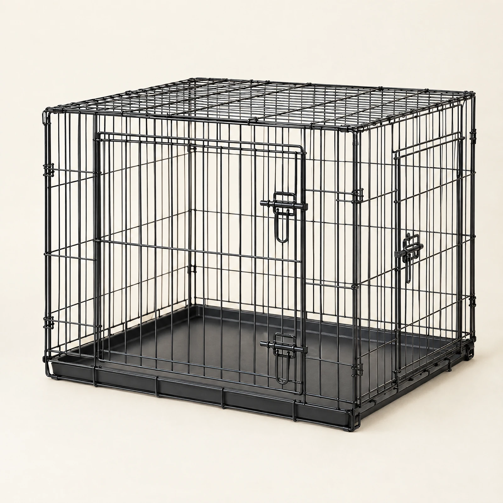 A black barred dog crate with front and side doors and a floor tray, empty, on a cream background